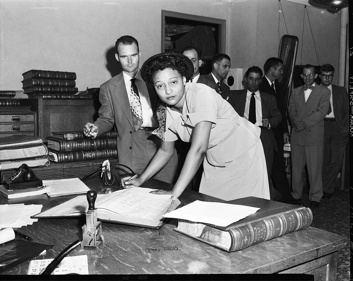 Copy of fig 11.3 Photo of Fisher signing the register of attorneys in 1952 OHS copy